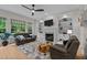 Cozy living room boasts a fireplace, built-in shelving, and a comfortable seating area at 13121 Sargas St, Raleigh, NC 27614