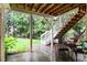 Covered patio area with stairs to back yard and room for seating at 13121 Sargas St, Raleigh, NC 27614