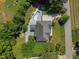 Aerial view of a home with a pool and surrounding greenery at 1420 Norwood Crest Ct, Raleigh, NC 27614