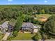 Scenic aerial view of the property with a pool and expansive wooded surroundings at 1420 Norwood Crest Ct, Raleigh, NC 27614