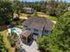Aerial view of the backyard showcasing the pool, patio, and lush landscaping at 1420 Norwood Crest Ct, Raleigh, NC 27614