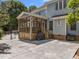Enclosed screen porch off the back of the home with backyard access to the pool area at 1420 Norwood Crest Ct, Raleigh, NC 27614