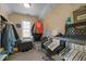 Functional walk-in closet with hanging racks, shelving and storage space, offering plenty of room for organization at 1420 Norwood Crest Ct, Raleigh, NC 27614