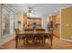 View of eat-in kitchen with wood cabinets and open to dining area at 1420 Norwood Crest Ct, Raleigh, NC 27614