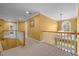 Upstairs hallway with stairs, windows, and a chandelier at 1420 Norwood Crest Ct, Raleigh, NC 27614