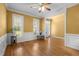 Living room featuring hardwood floors, white trim, and transom windows at 1420 Norwood Crest Ct, Raleigh, NC 27614