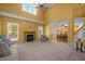 Cozy living room with fireplace, carpet and lots of natural light at 1420 Norwood Crest Ct, Raleigh, NC 27614
