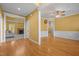 Open-concept living area with hardwood floors and white trim, showcasing the home's flow at 1420 Norwood Crest Ct, Raleigh, NC 27614