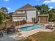 Backyard swimming pool features concrete patio, picnic table, and access to a screened-in porch at 1420 Norwood Crest Ct, Raleigh, NC 27614