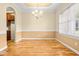 Dining room showcasing hardwood flooring, decorative lighting, and neutral wall tones at 1420 Taylor Farm Rd, Raleigh, NC 27603