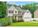 Charming two-story home with a well-manicured lawn and attached garage, set in a peaceful neighborhood at 1420 Taylor Farm Rd, Raleigh, NC 27603
