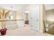 Well-lit upper hallway with a view into the front yard at 1420 Taylor Farm Rd, Raleigh, NC 27603