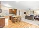 Spacious open-concept kitchen leading to a living area with hardwood and carpet flooring at 1420 Taylor Farm Rd, Raleigh, NC 27603