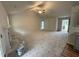 Bright and airy open living space with fireplace flows to kitchen, complete with vaulted ceilings and neutral finishes at 151 Oakfield Trace Dr, Four Oaks, NC 27524