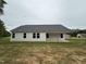 The back exterior shows siding, a gray roof, and a covered porch at 188 Oakfield Trace Dr, Four Oaks, NC 27524