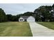 Charming one-story home with a well-manicured lawn and a long driveway leading to an attached garage at 188 Oakfield Trace Dr, Four Oaks, NC 27524