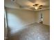 Expansive main bedroom with tray ceilings, a ceiling fan, and soft carpet flooring for comfort at 188 Oakfield Trace Dr, Four Oaks, NC 27524