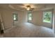 Large main bedroom with tray ceilings, a ceiling fan, carpet flooring, and abundant natural light at 188 Oakfield Trace Dr, Four Oaks, NC 27524