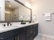 Double vanity bathroom with a frameless glass shower, modern fixtures, and great lighting at 2008 Van Hook Ln, Apex, NC 27502