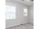 Bedroom with a carpet floor, two windows and neutral colored walls at 2008 Van Hook Ln, Apex, NC 27502