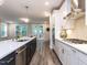 Contemporary kitchen featuring stainless appliances, pendant lights, white cabinets, and a gas range at 2008 Van Hook Ln, Apex, NC 27502