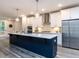 Modern kitchen featuring a large island, stainless steel appliances, and ample cabinet space at 2008 Van Hook Ln, Apex, NC 27502