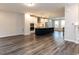 Open-concept layout showcasing the living room and kitchen with modern finishes and ample space at 2008 Van Hook Ln, Apex, NC 27502
