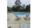 The neighborhood swimming pool with lounge chairs and umbrellas, promising a relaxing experience for community members at 2008 Van Hook Ln, Apex, NC 27502