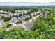 Picturesque neighborhood with lush green trees and manicured lawns surrounding beautiful homes at 213 Preatonwood Dr, Apex, NC 27539