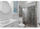 Bathroom with a tile shower and clear glass door, commode and a white sink at 213 Preatonwood Dr, Apex, NC 27539