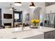 Open concept kitchen and living area featuring stainless steel appliances and lots of natural light at 213 Preatonwood Dr, Apex, NC 27539