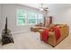 Cozy living room with comfortable seating, soft carpet, and a large window for natural light at 213 Preatonwood Dr, Apex, NC 27539
