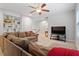 View of living room with built-in bookshelves, comfortable seating, and a media center at 213 Preatonwood Dr, Apex, NC 27539