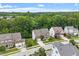 A beautiful neighborhood featuring lush trees, sidewalks, and well-maintained homes at 213 Preatonwood Dr, Apex, NC 27539