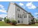 View of the house with a well-manicured lawn and back porch, featuring a grey siding exterior at 213 Preatonwood Dr, Apex, NC 27539