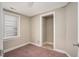Cozy bedroom with plush carpet, a bright window, and ample closet space, perfect for restful nights at 230 Park Ave, Rocky Mount, NC 27801