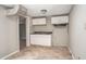 Compact kitchen features white cabinets, laminate countertops, and tiled flooring at 230 Park Ave, Rocky Mount, NC 27801