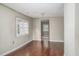 Inviting living room with hardwood floors, a large window, and neutral tones, creating a cozy atmosphere at 230 Park Ave, Rocky Mount, NC 27801
