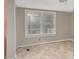 Utility room or office space, featuring tiled floors and natural light from a large window at 230 Park Ave, Rocky Mount, NC 27801