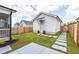 Well-maintained backyard featuring a patio, landscaping, and a fence at 248 Daniel Ridge Rd, Wendell, NC 27591