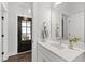 Bright bathroom with marble vanity top, modern fixtures, and views to the outside at 248 Daniel Ridge Rd, Wendell, NC 27591