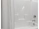 Clean, all white bathtub and shower combination with shower curtain and chrome fixtures at 248 Daniel Ridge Rd, Wendell, NC 27591