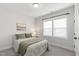 Neutral bedroom with a patterned bedspread, plush pillows, and lots of natural light at 248 Daniel Ridge Rd, Wendell, NC 27591
