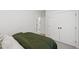 Bright bedroom with neutral walls, carpet, and a door to the en-suite bathroom at 248 Daniel Ridge Rd, Wendell, NC 27591