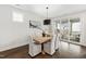 Dining room with sliding glass doors to the patio, wood table, and elegant chandelier at 248 Daniel Ridge Rd, Wendell, NC 27591
