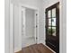 Inviting entryway with hardwood floors, a dark front door with glass panes, and neutral paint at 248 Daniel Ridge Rd, Wendell, NC 27591