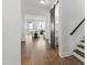 Open foyer with hardwood flooring, black barn door, and a view into the bright living room at 248 Daniel Ridge Rd, Wendell, NC 27591