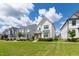 Suburban street with several two-story homes and manicured lawns showing a traditional-style neighborhood on a clear day at 248 Daniel Ridge Rd, Wendell, NC 27591