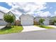 Row of detached garages showing white doors, ample parking, and wood fence surrounds with newly planted trees at 248 Daniel Ridge Rd, Wendell, NC 27591