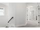 Hallway with light-colored walls, staircase, and access to the upper rooms at 248 Daniel Ridge Rd, Wendell, NC 27591